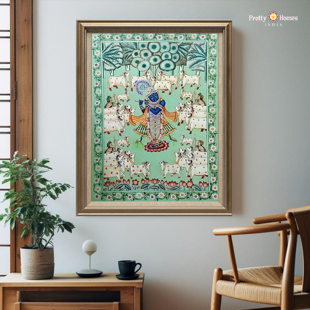 Front view of Pichwai painting showing Shreenathji surrounded by cows in vibrant natural tones