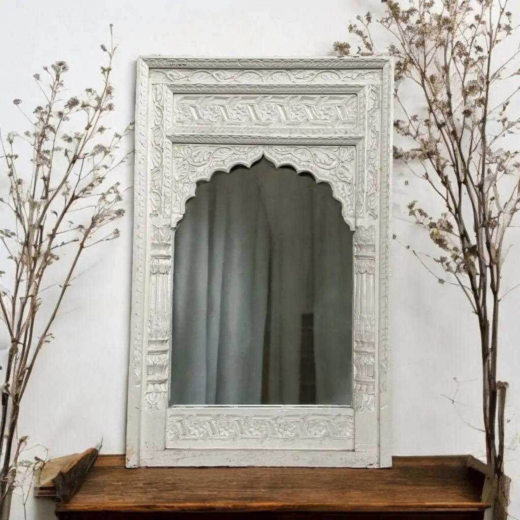 Floral carving close-up — handcrafted jharokha mirror wooden detailing.