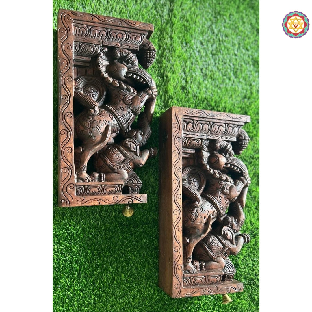 Side profile of wooden Yali bracket showing elephant trunk detail and ornate floral carvings