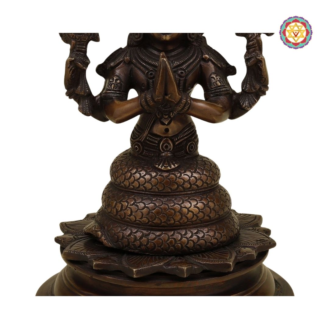 angled shot of Kali sculpture with decorative base and textured finish
