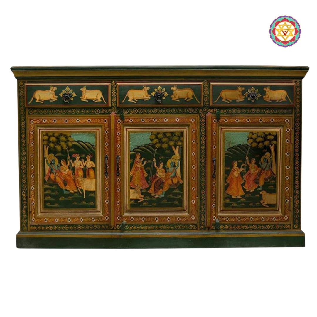 Studio image of pichwai painting of Rajasthan on 3-door cabinet featuring Krishna and pichwai cow artwork.