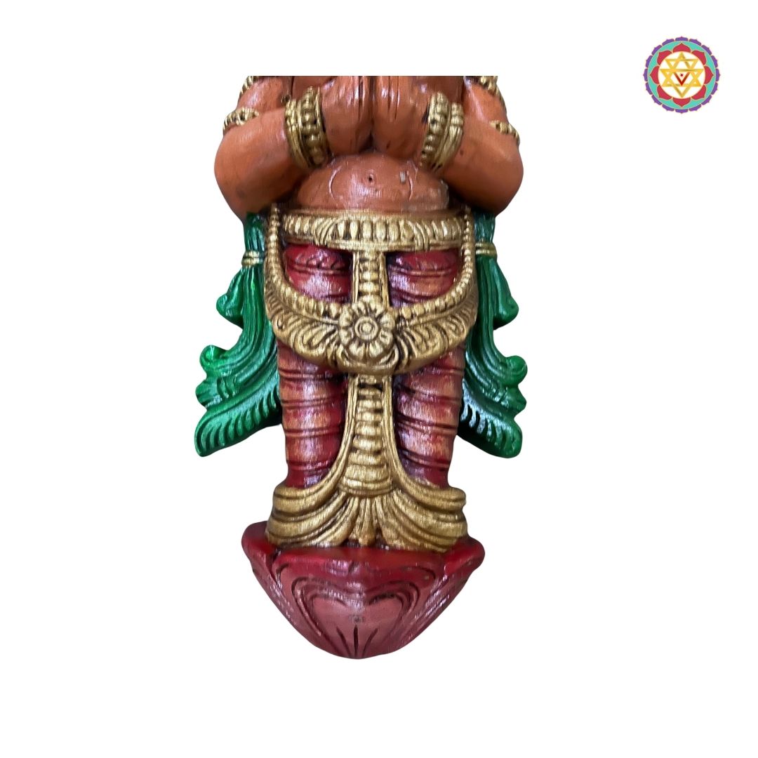 Side view of wooden Ram and Sita sculptures mounted on wall