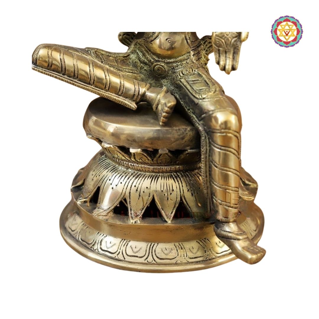 Saraswati idol displayed in traditional decor setting