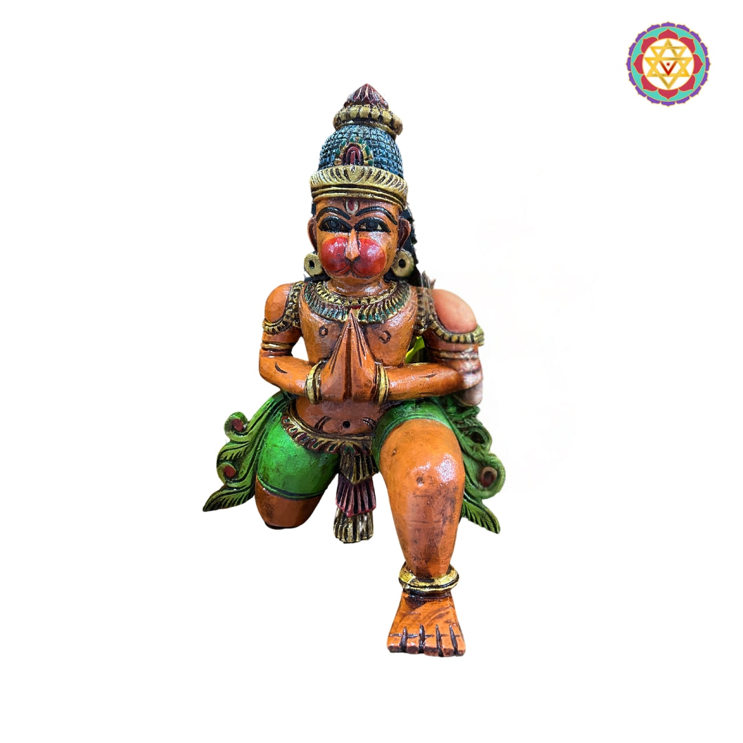 Close-up of Hanuman wooden idol showing expressive face and hand posture — handcrafted devotional art with antique detailing