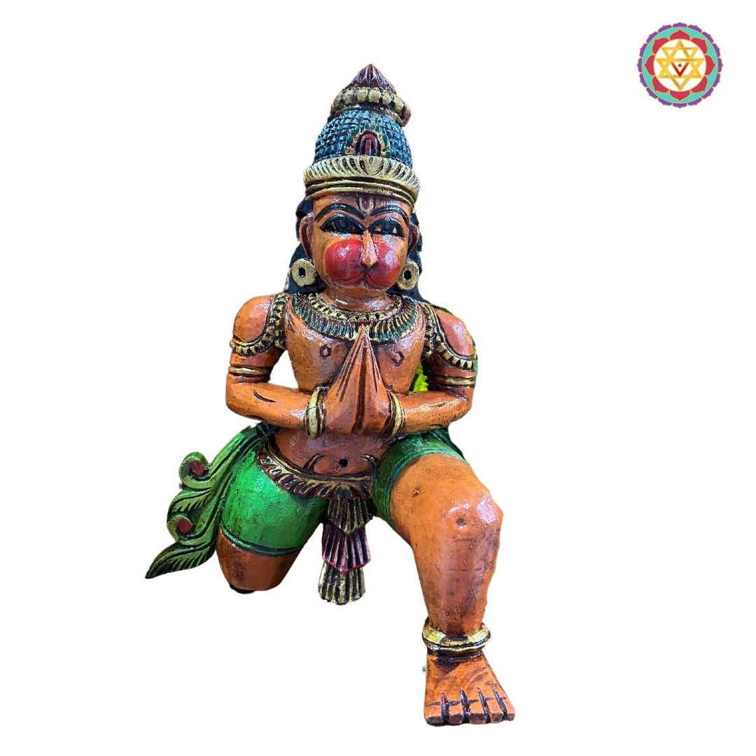 Side view of sitting Hanuman sculpture — detailed carving of robes and ornaments, spiritual wooden art for pooja room