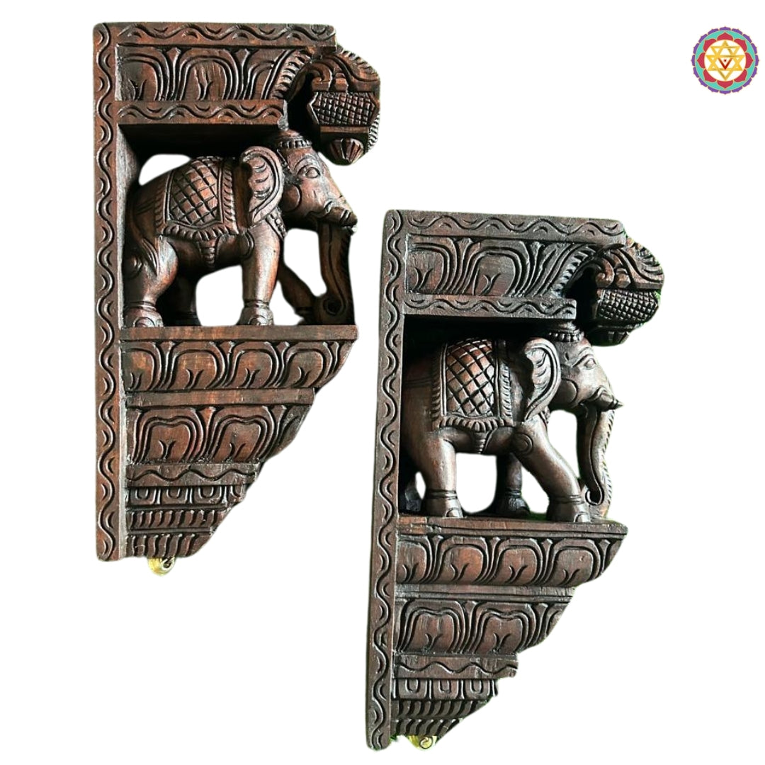 Detailed close-up of elephant wall bracket showing tusks and layered handcarved scrollwork