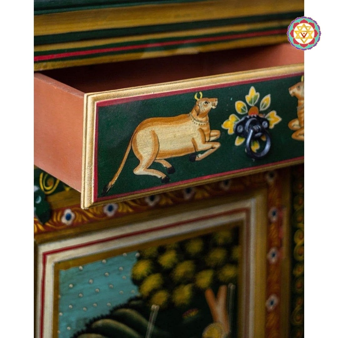 Detail of pichwai cow designs painted on top drawers in classic pichwai painting style.