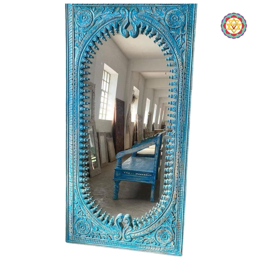 Vertical view of the blue carved mirror in natural light