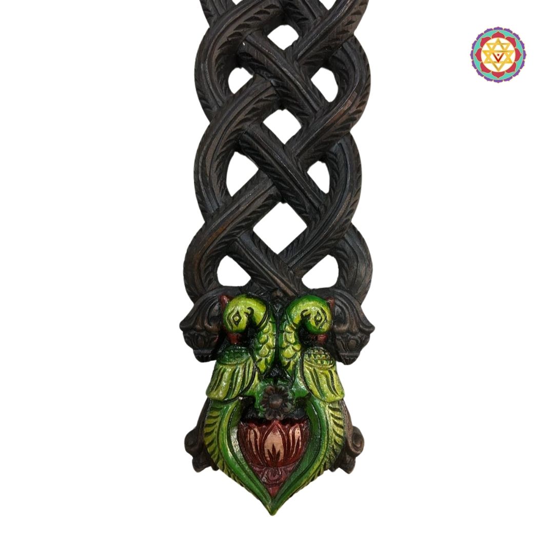 Intricate bird carvings on multicolour wooden ladle decor