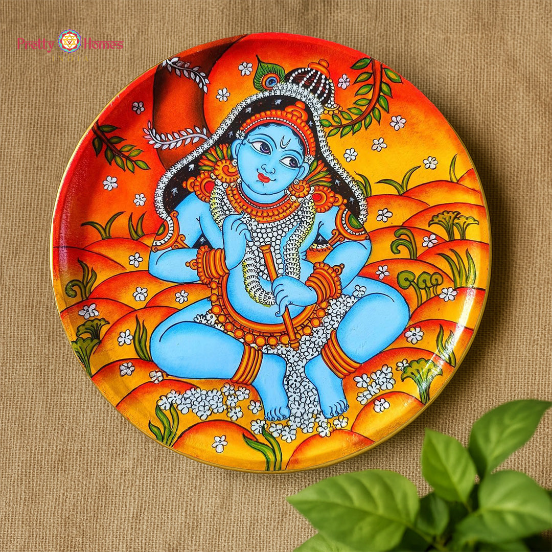 Bal Krishna Kerala mural wall plate with playful pose and decorative handpainted patterns