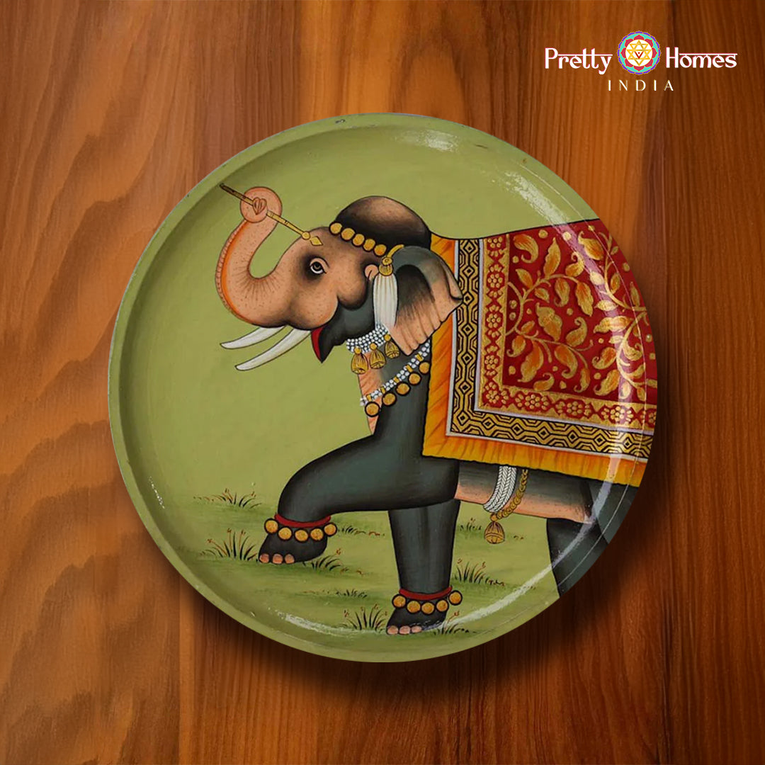 Hand-painted round plate featuring decorative elephant on olive-green background