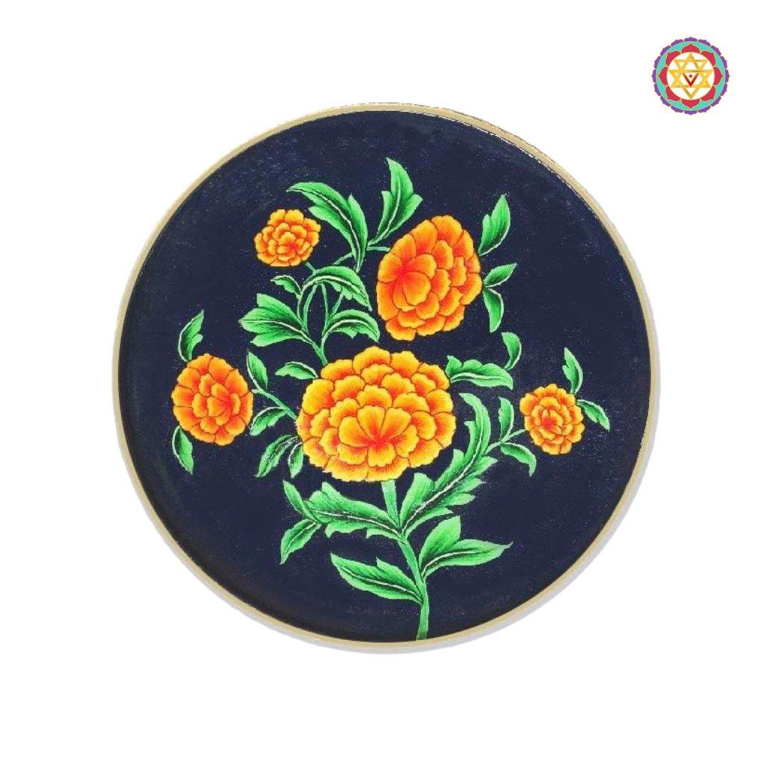 Round pichwai wall plate featuring hand-painted marigold flowers.