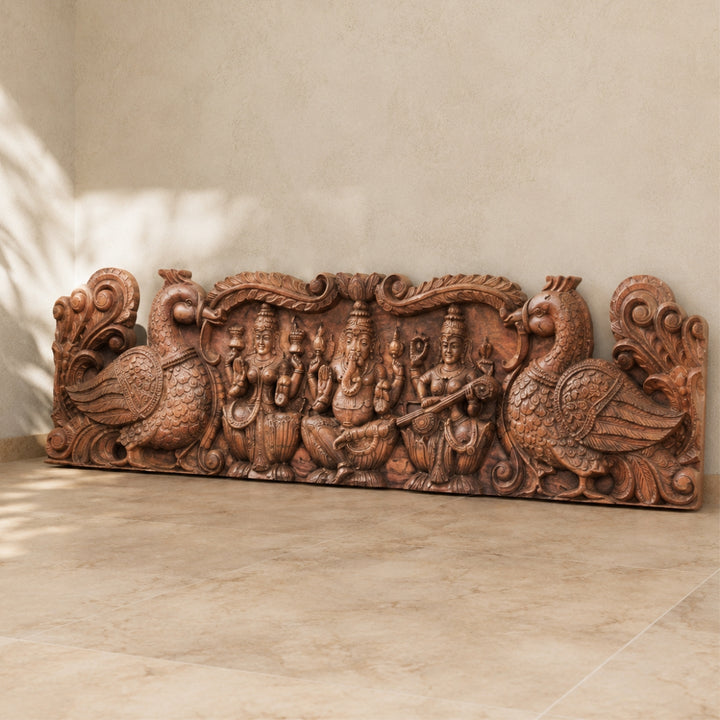 Teak Carved Panel — Ganesh, Laxmi & Saraswati with Peacocks
