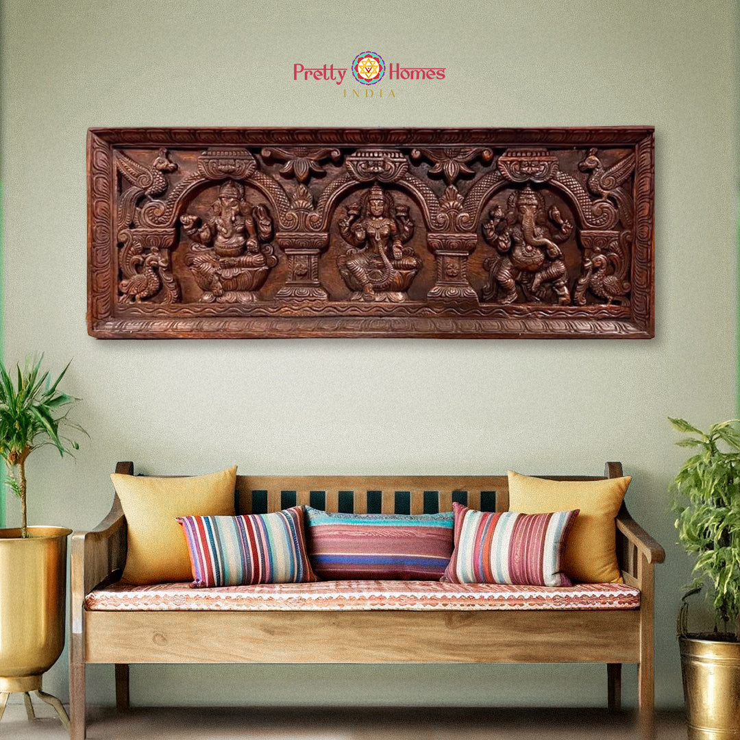 Horizontal carved wooden wall panel with Ganesha and Lakshmi