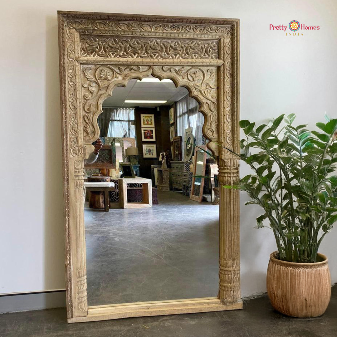 “Handcarved wooden Jharokha mirror with natural wood finish – elegant floral and geometric designs.”