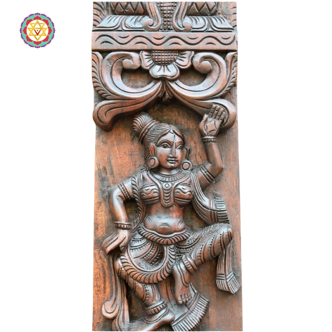 handcarved wooden wall panel showing apsara musicians in traditional design