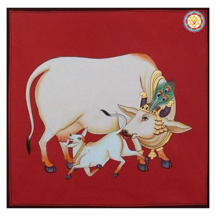 Close-up of pichwai artwork showing Kamadhenu with a small calf and peacock feather detail.