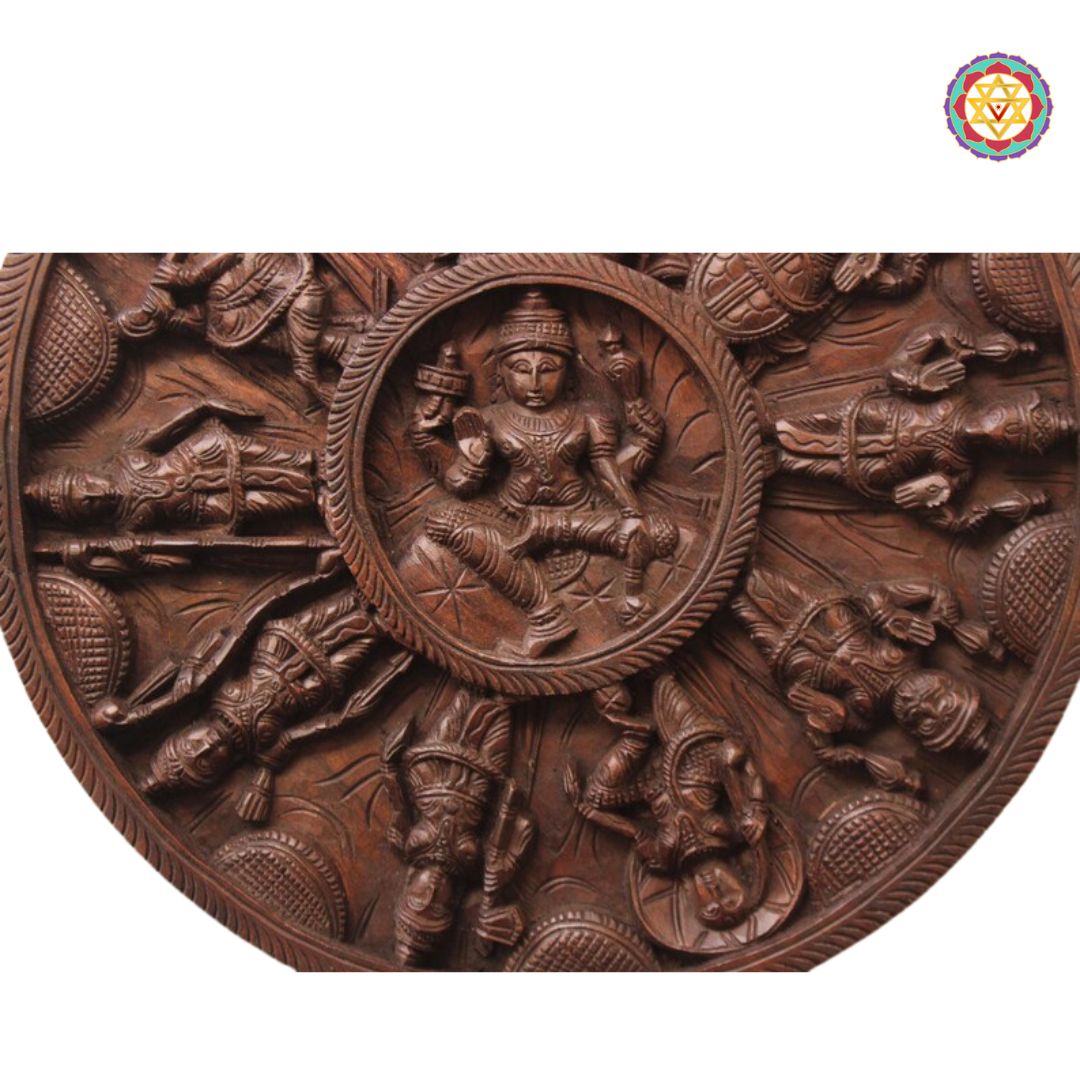 Wooden relief sculpture with intricate carvings on a white background. Angular top-down view of circular wood panel.