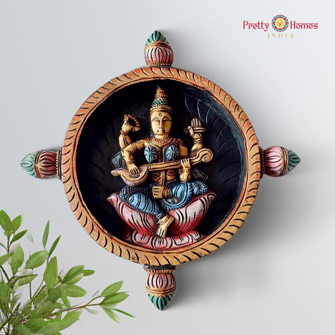 Wooden round wall plate featuring Goddess Saraswati with veena