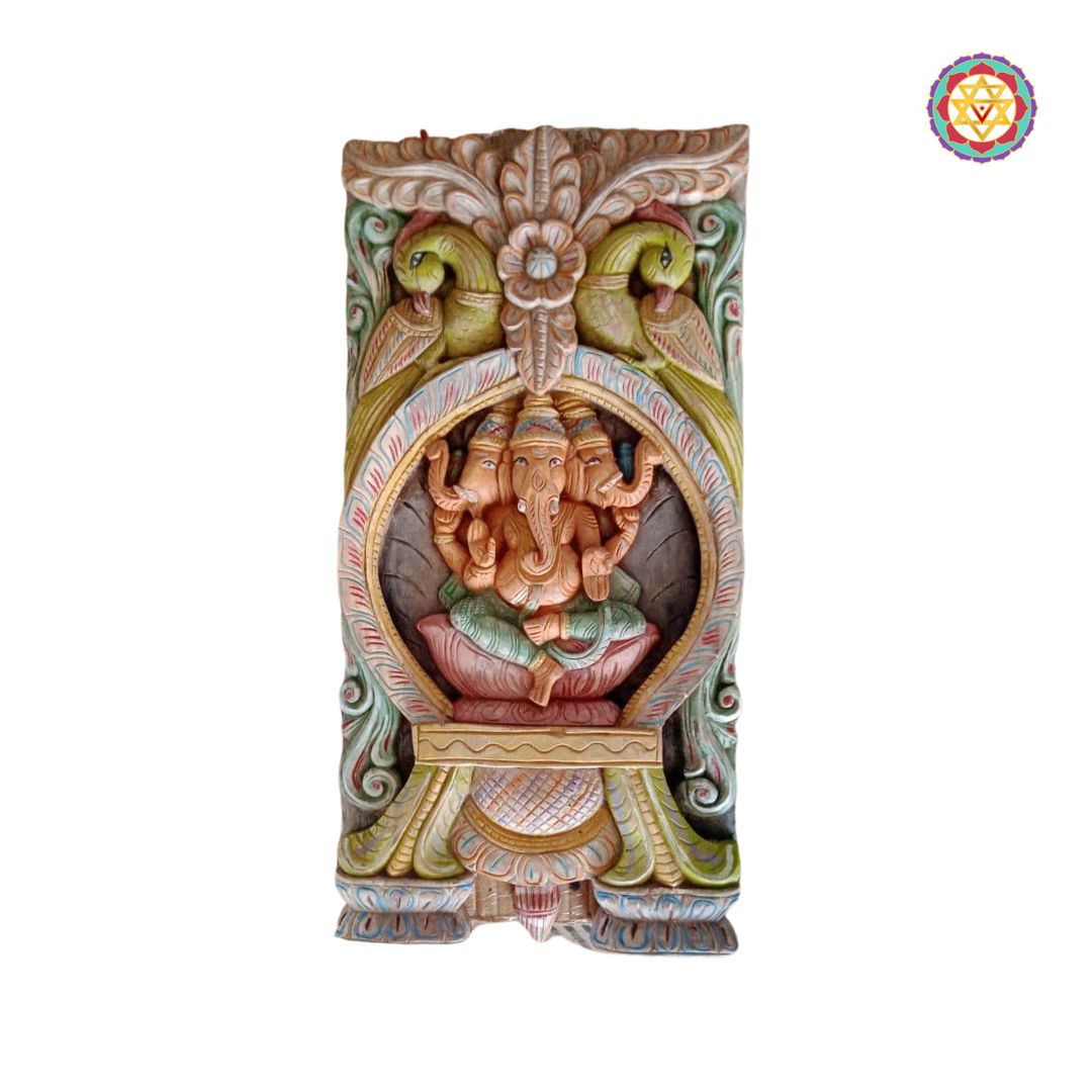 Close-up of hand-carved Tri Mukh Ganesha wall panel in antique multicolour