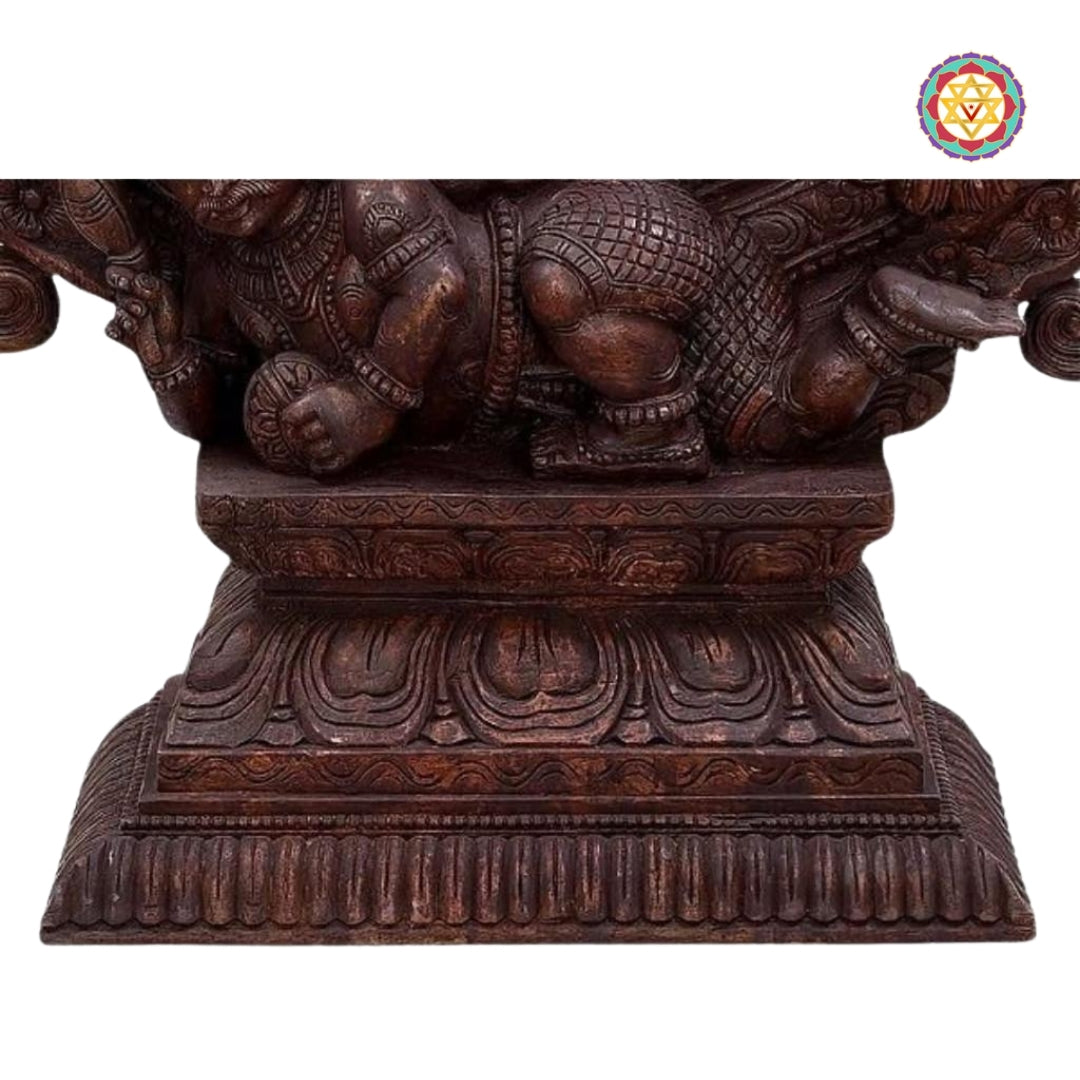 close-up of wood carved nataraja figure with halo design