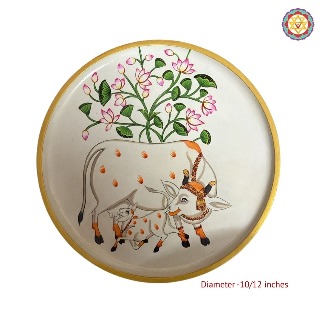 Close view of cow and calf handpainted wall plate with lotus detailing
