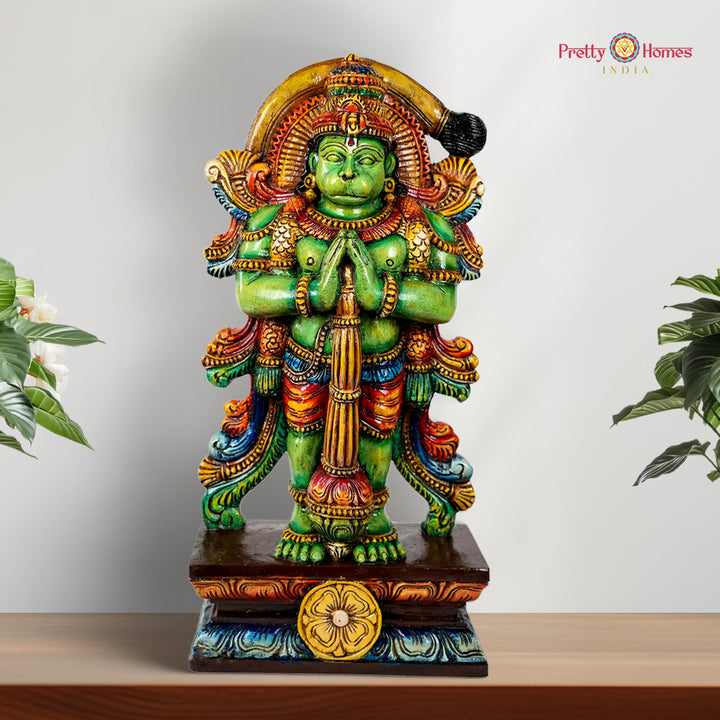 This handcrafted standing Lord Hanuman statue, carved in Vagai wood, denotes to Indian artistry and culture .