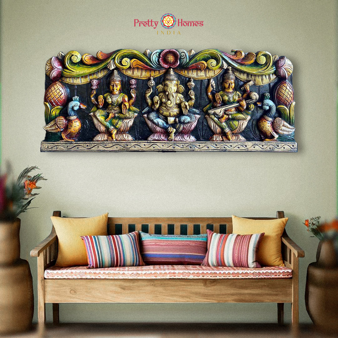 Ganesh Lakshmi Saraswati wooden wall panel above bench