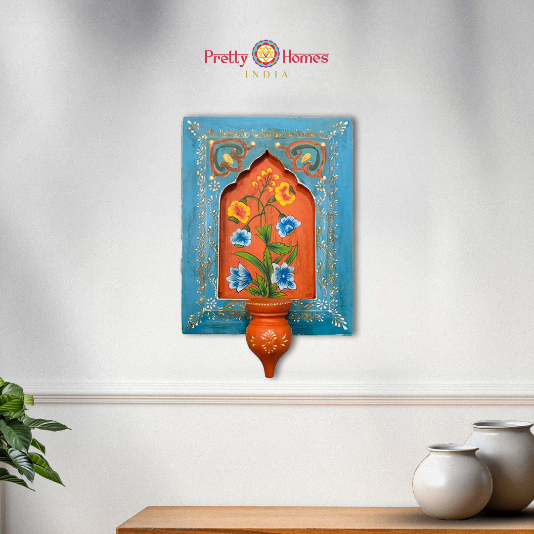 Blue hand-painted wooden wall frame with floral artwork

