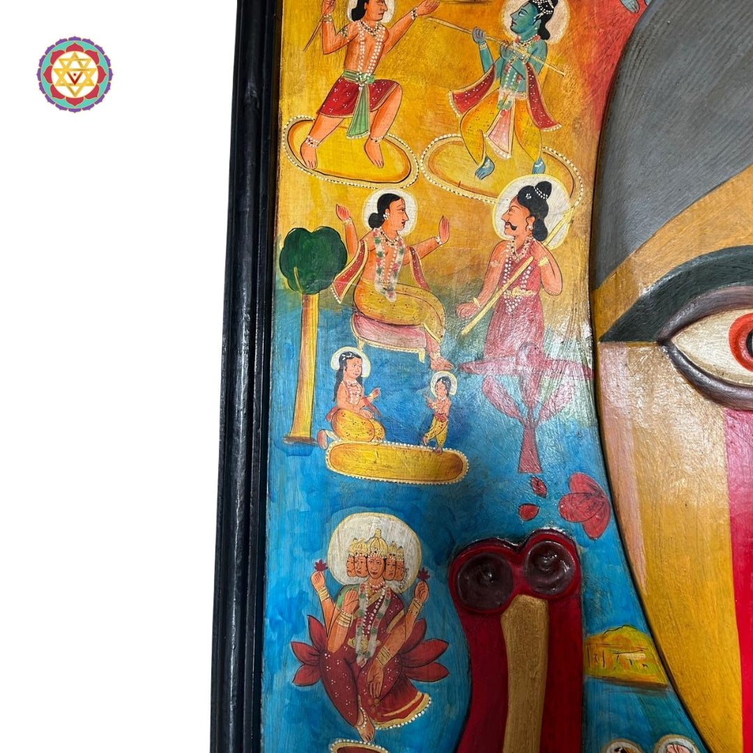 Handcrafted wooden Ganesha mask with detailed carvings