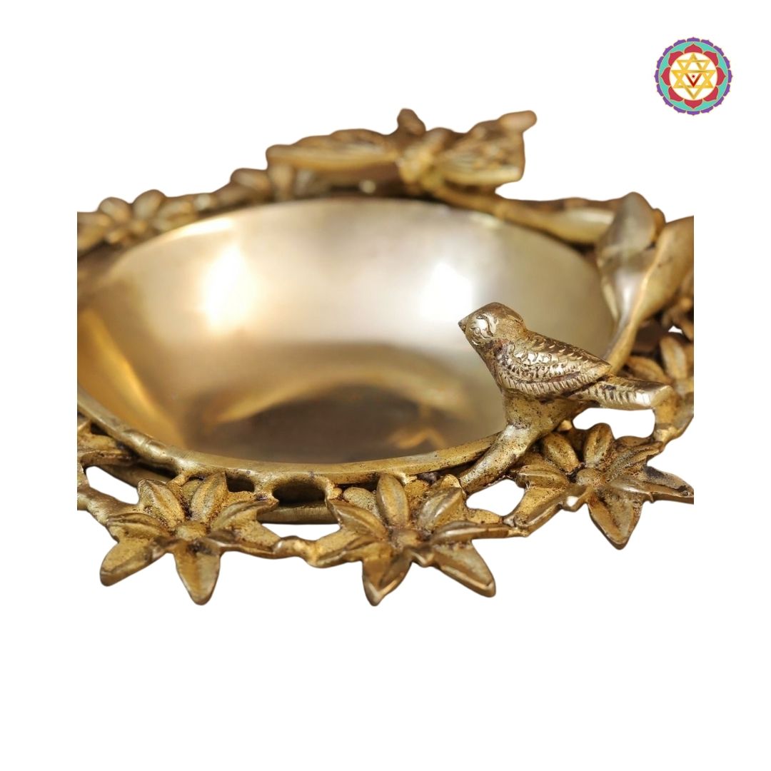angled view of floral uruli showcasing shallow bowl suitable for floating flowers