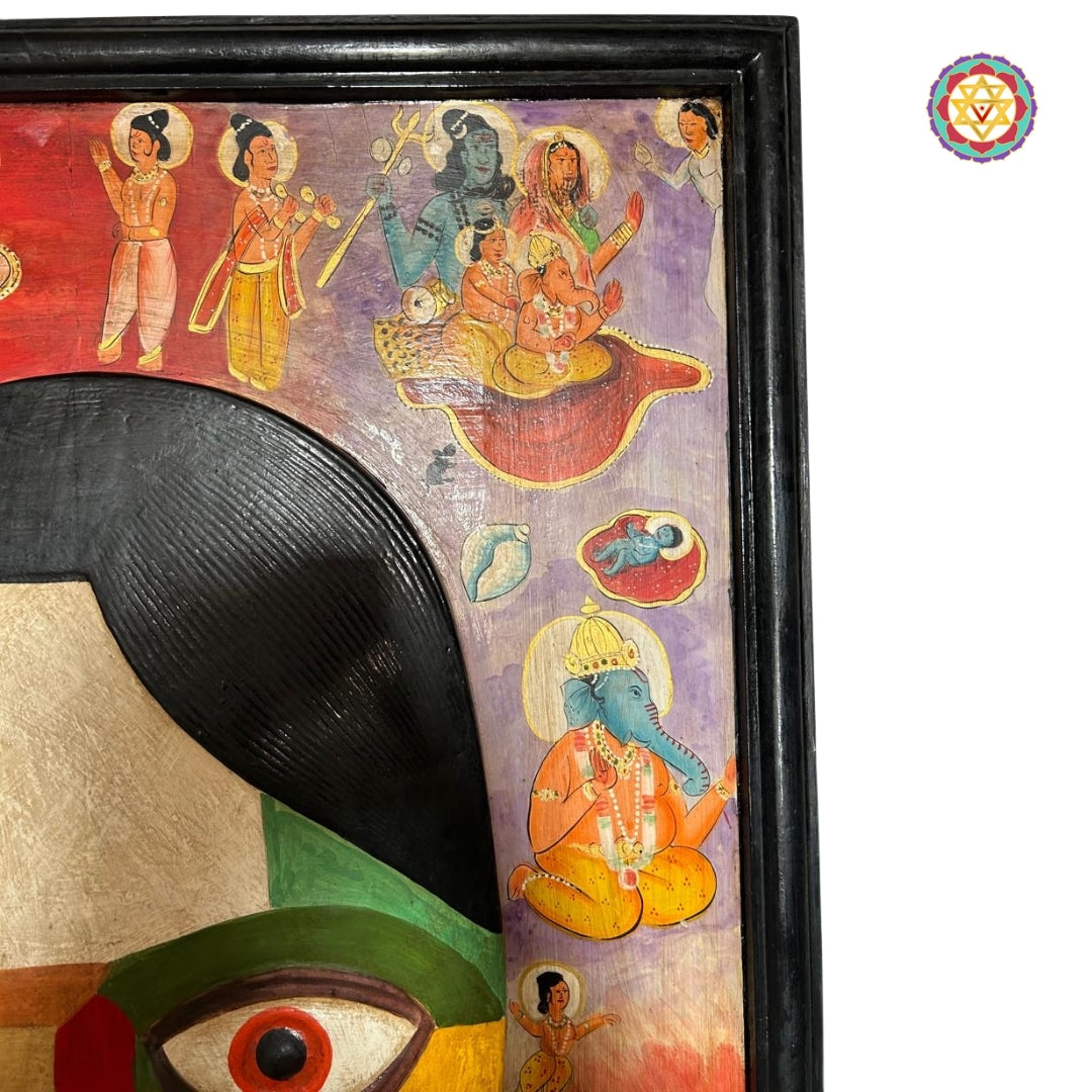 Wooden Ganesha mask with expressive eyes