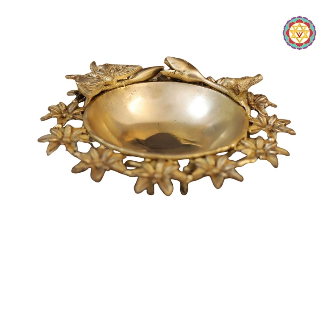 top-angle shot of uruli tray displaying engraved base and circular motif