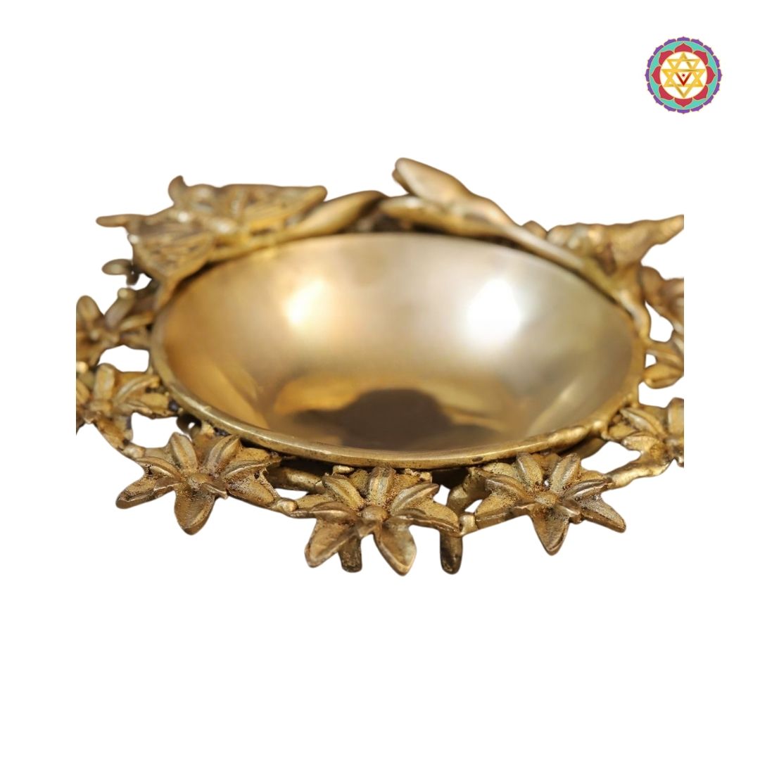 decorative uruli set on table with reflective golden polish and subtle patina