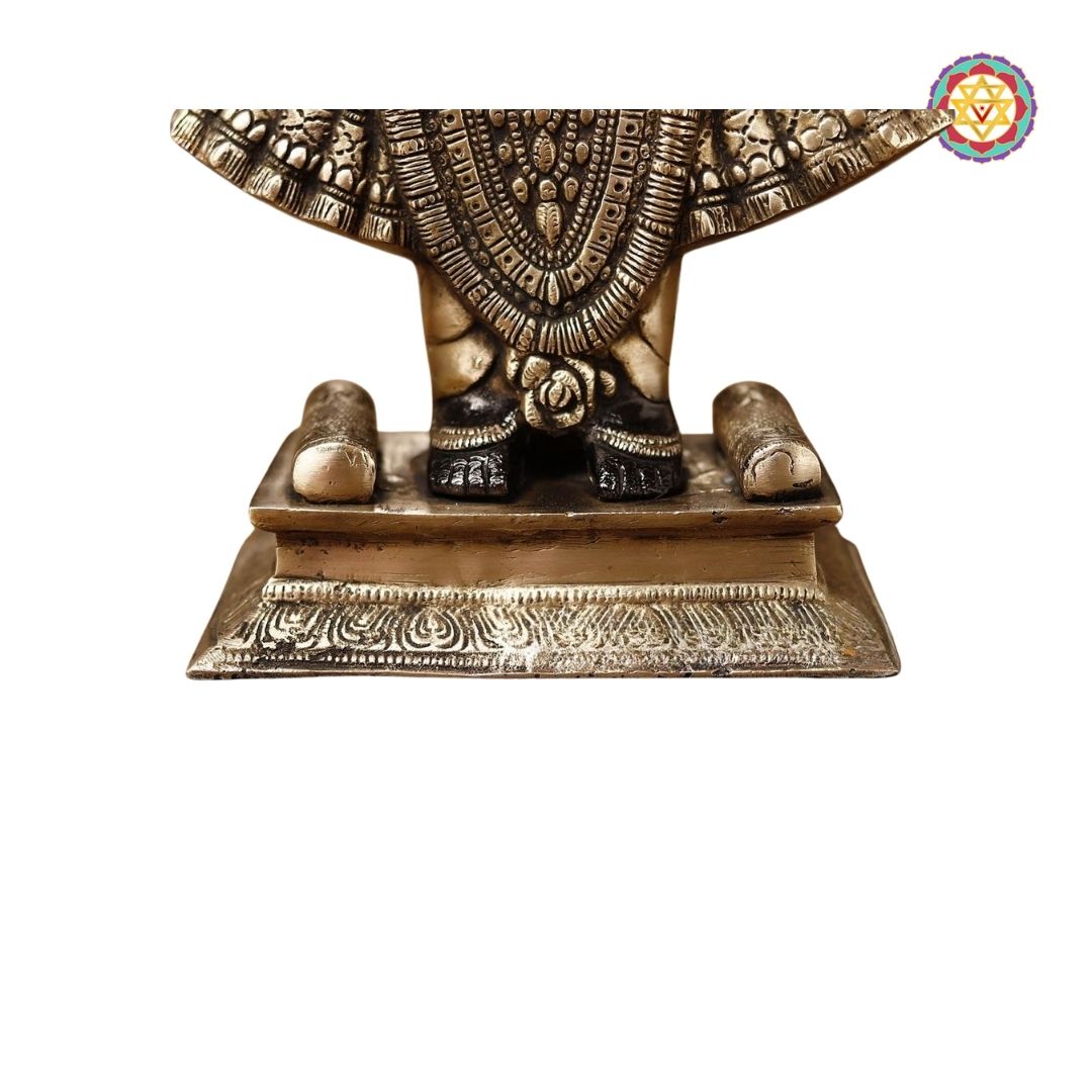 back view showing detailed carvings on idol