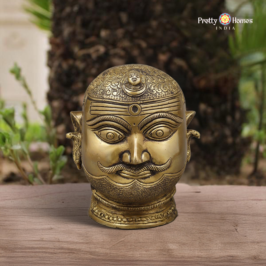 brass Shiva face idol with rustic golden finish and expressive features