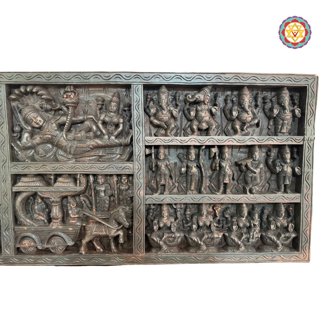 Detailed carving of horses and chariot elements in wooden panel