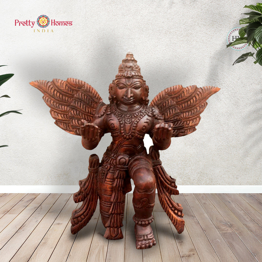 Hand-carved wooden Garuda sculpture in meditation pose — antique gold brown finish, sacred bird deity statue for home temple decor
