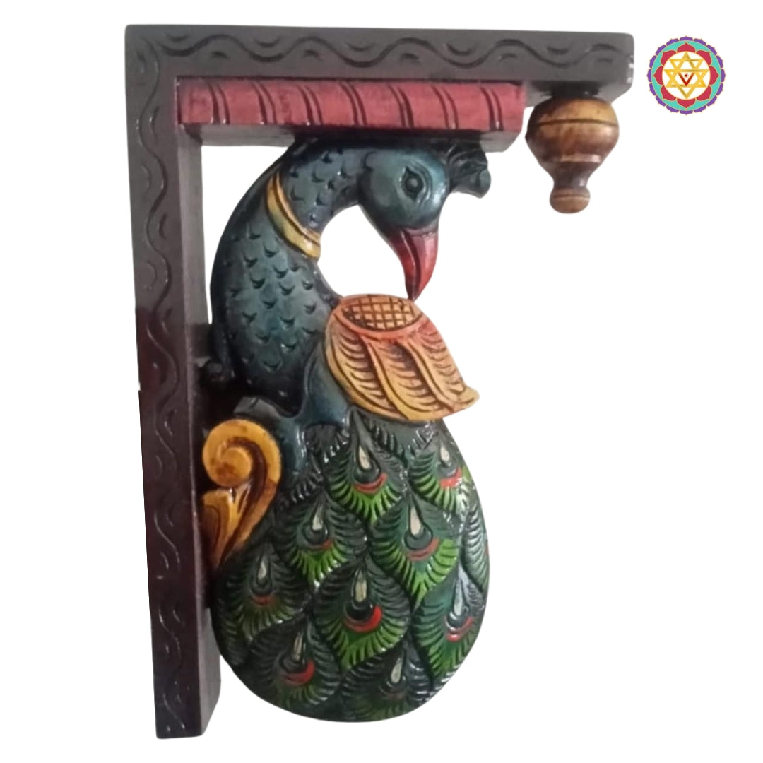 Angled shot of wooden peacock wall hanging showing elegant curves and artisan craftsmanship