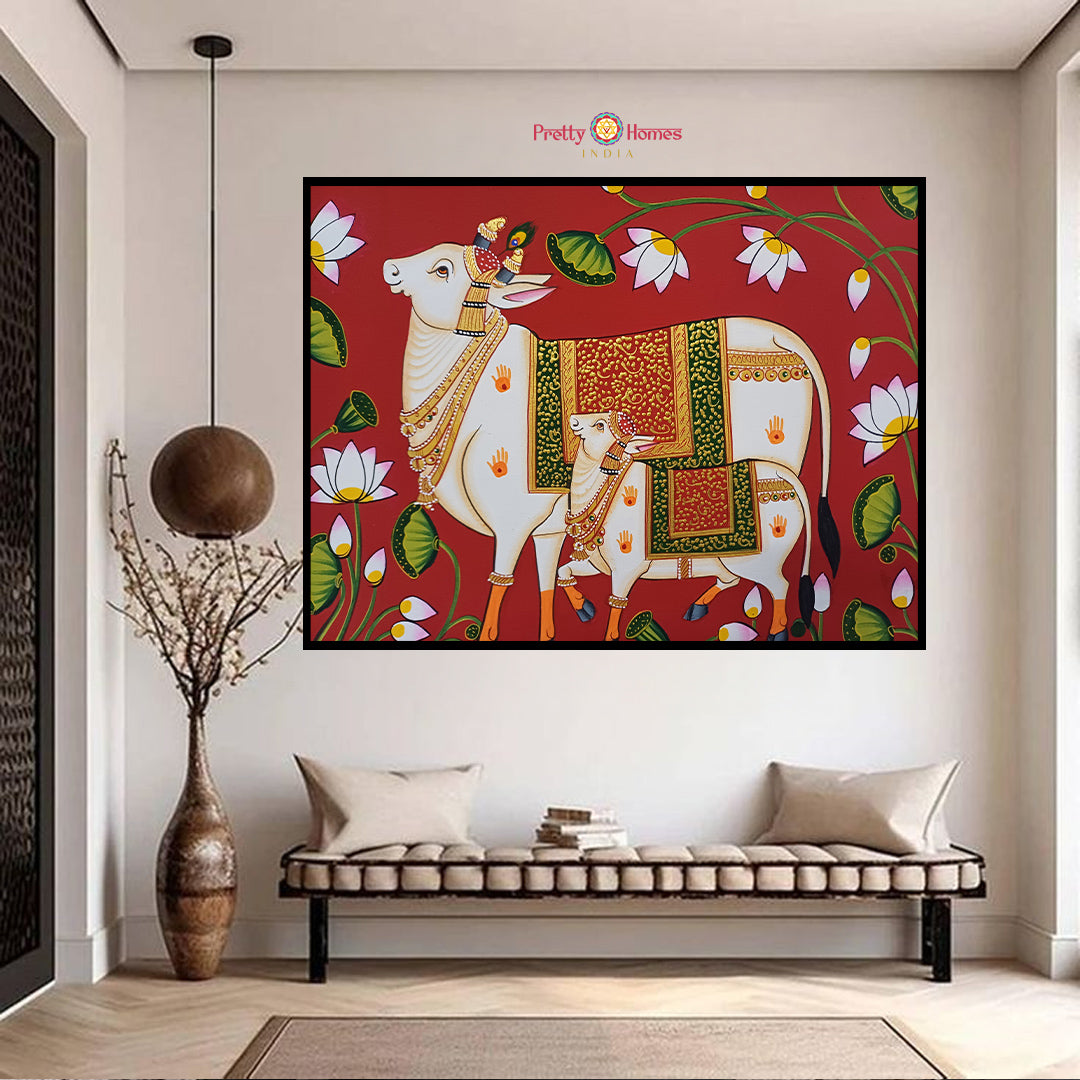 hand-painted red pichwai painting of cow with calf and lotus flowers