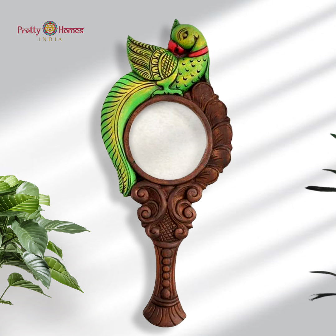 Handcarved wooden mirror frame with single green parrot design