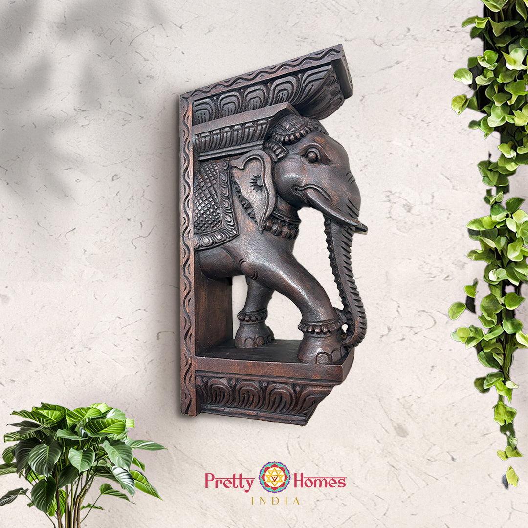 Hand-carved wooden wall bracket featuring Ganesh and elephant design