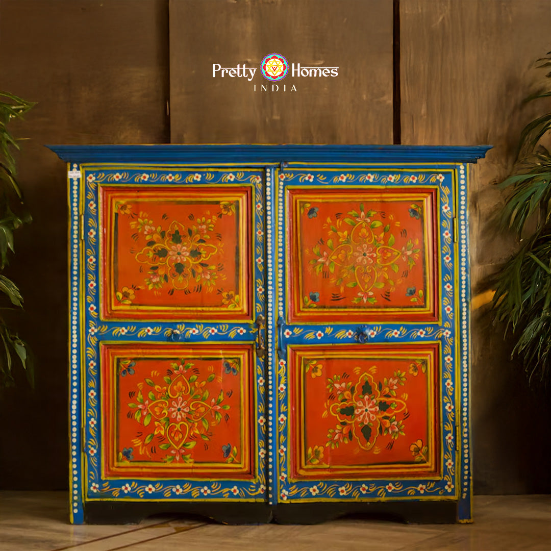 Wooden storage cabinet with floral motifs full front view