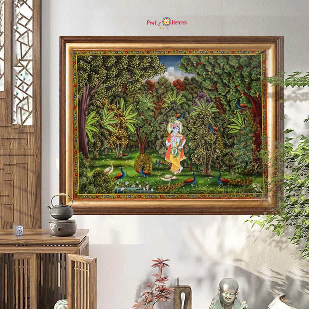 horizontal handpainted pichwai krishna playing flute in forest setting close-up revealing brushwork on foliage and flute-playing figure