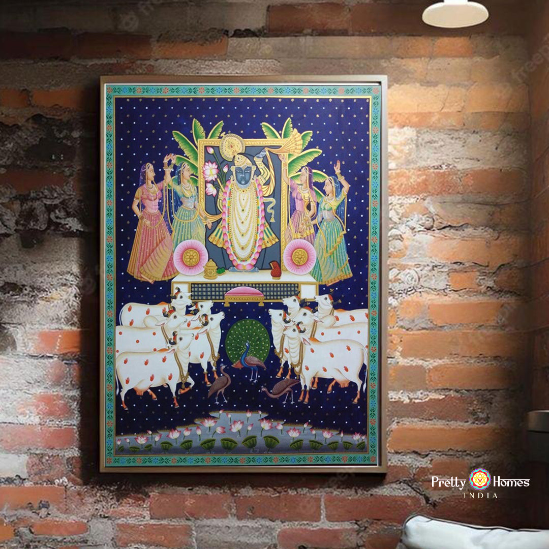 Framed Shreenathji Pichwai painting with gopikas and pichwai cows, hand-painted on cloth. Ideal for pichwai wall art and home temples.