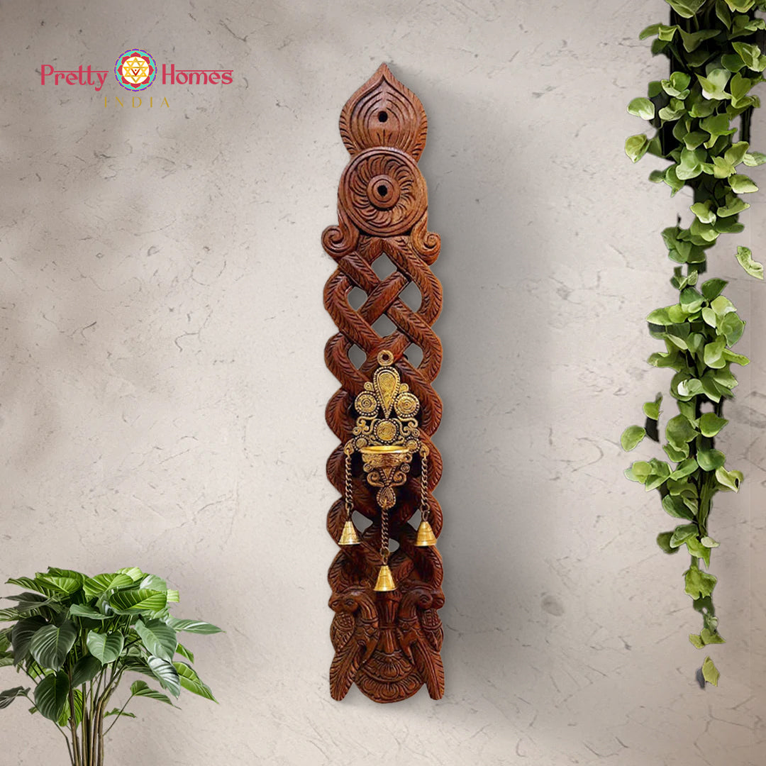 Full view of vintage carved wooden spoon with brass Deepam