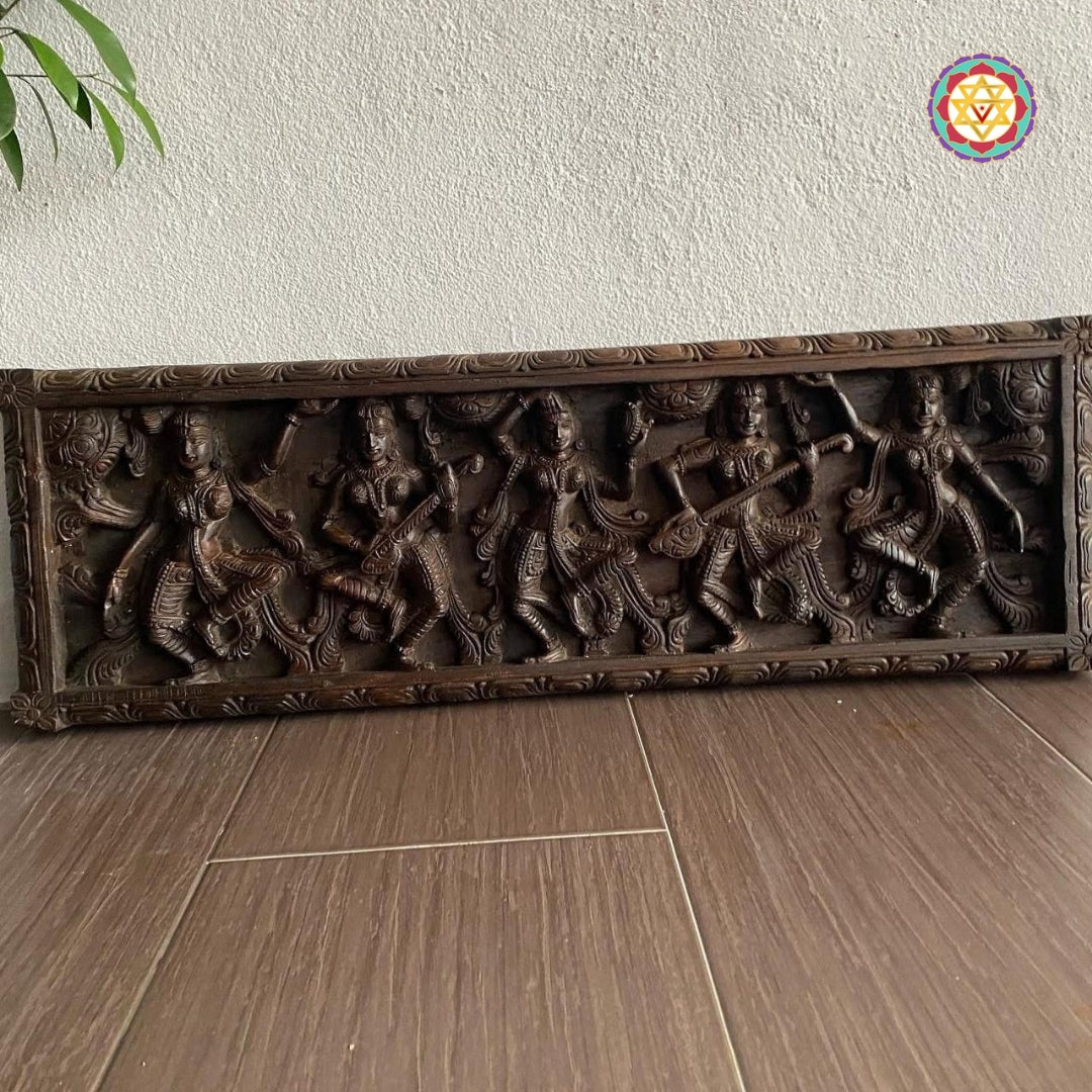 Indian wooden wall art featuring Apsaras with flute and sarangi