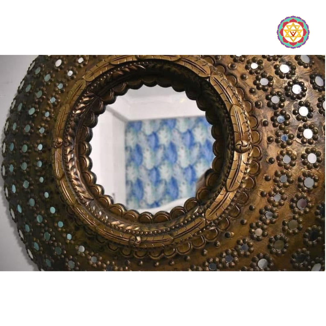 Close-up of the inset mirrors and carved detailing