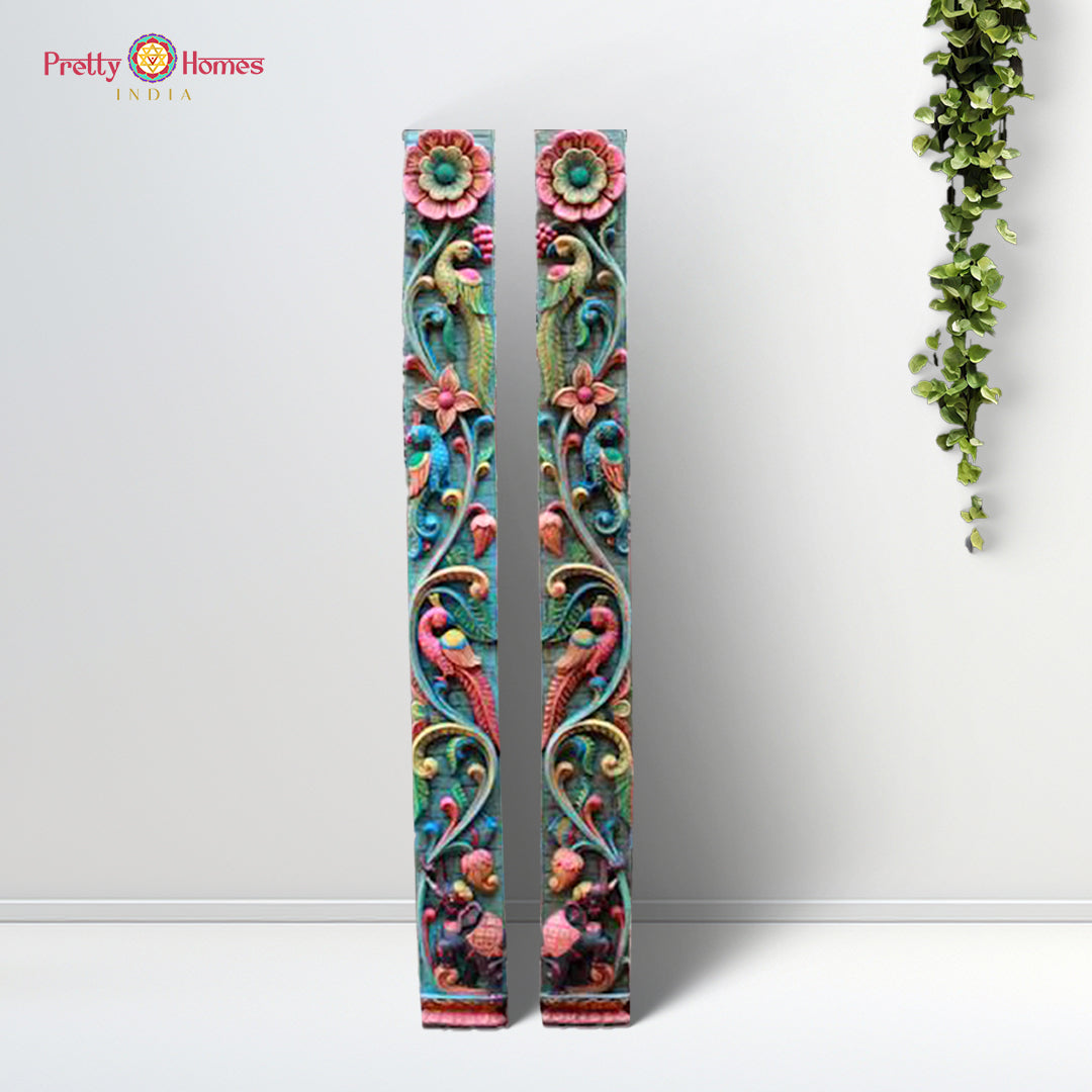 Vertical wood panel pair with floral, parrot, and elephant carvings