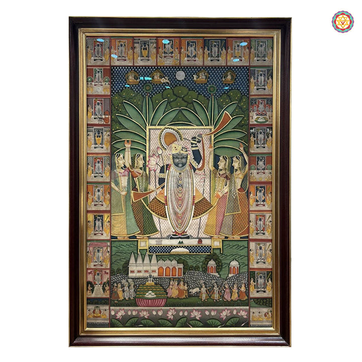 Framed miniature style deity painting with ornate border scenes and intricate narrative panels